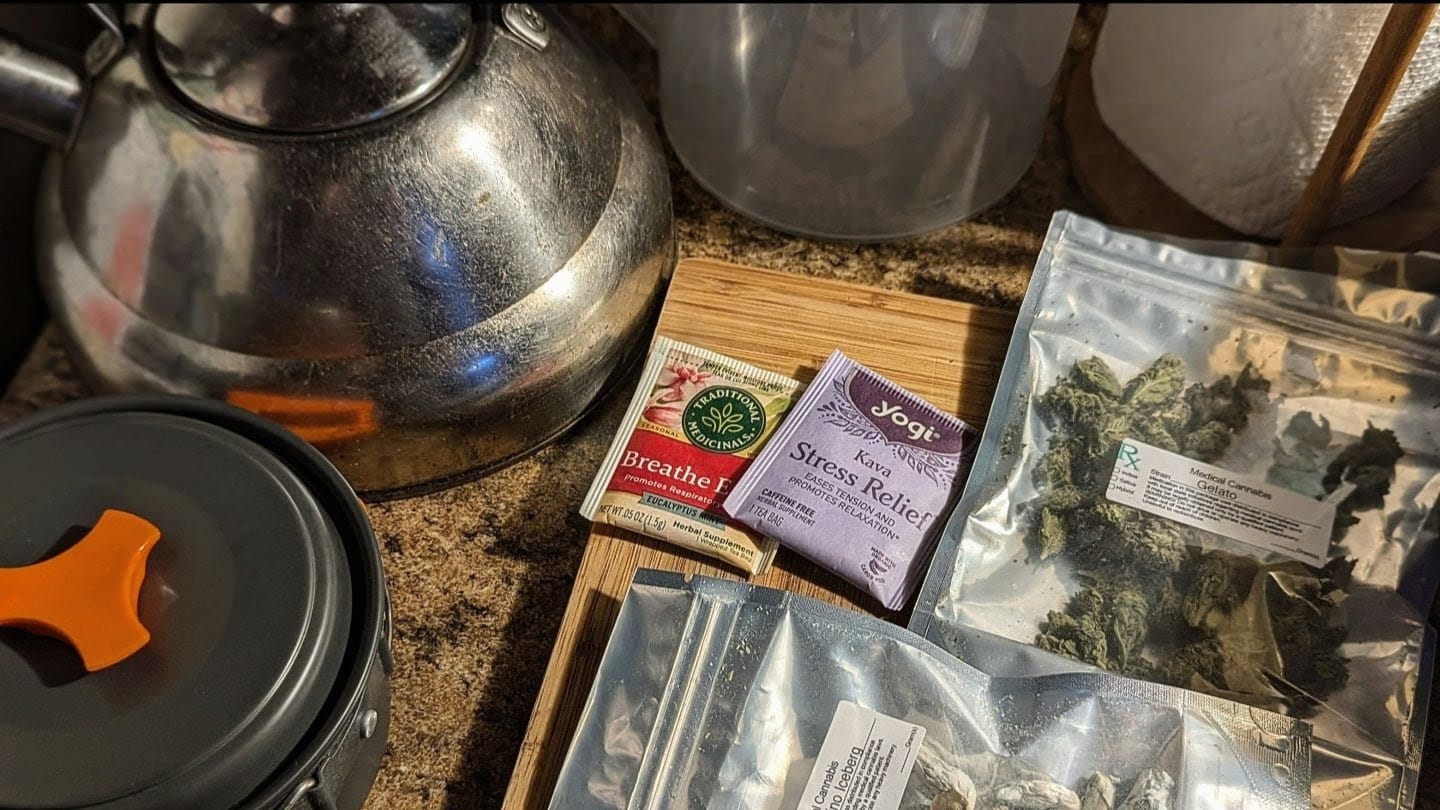 Teas beside bagged flower on counter