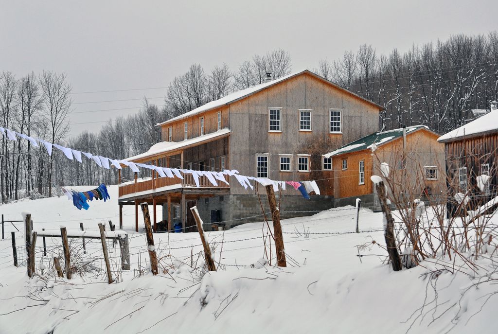Amish farmhouse in winter with laundry lines adding humidity