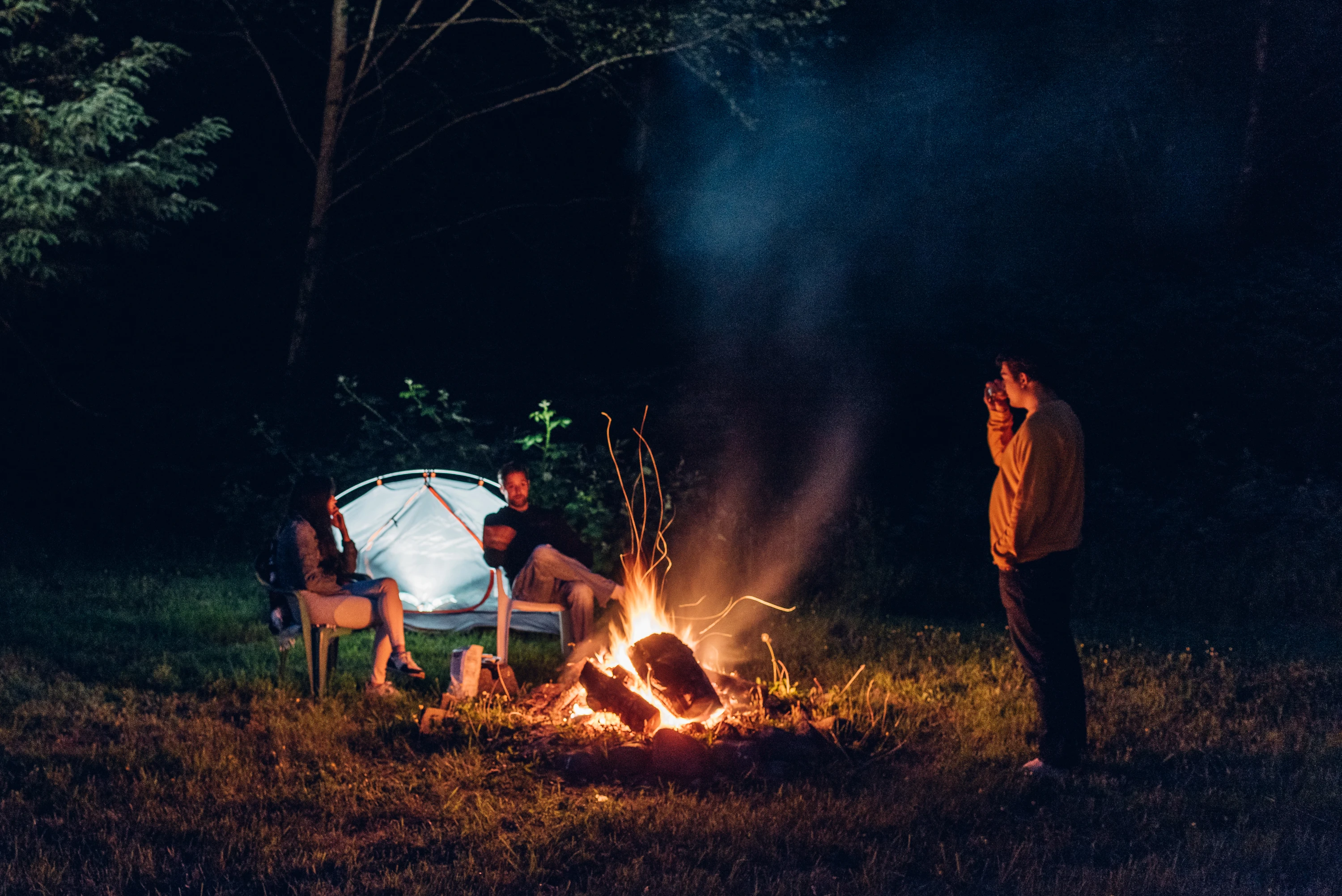 Tent and campfire at night